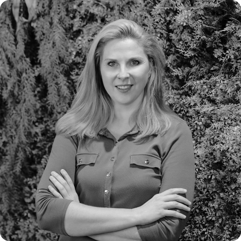 Jurgita Radzevičė, CEO of SBA Home, stading with her arms crossed