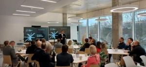 Lukas Geryba, Head of Open Innovation Centre, is presenting in front of an audience during a strategic session